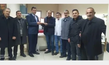 Muhtarlar Iğdır Ağız Diş Sağlığı Merkezi Müdürü Orhan Çelik'i ziyaret etti